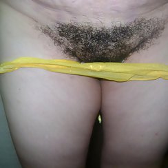Sexy Babe Pulls Down Yellow Panties And Exposes Hairy Pussy